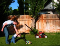 Reesie and Daddy mowing lawn