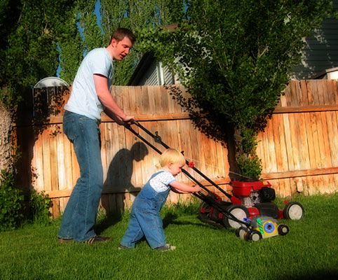 Reesie and Daddy mowing lawn